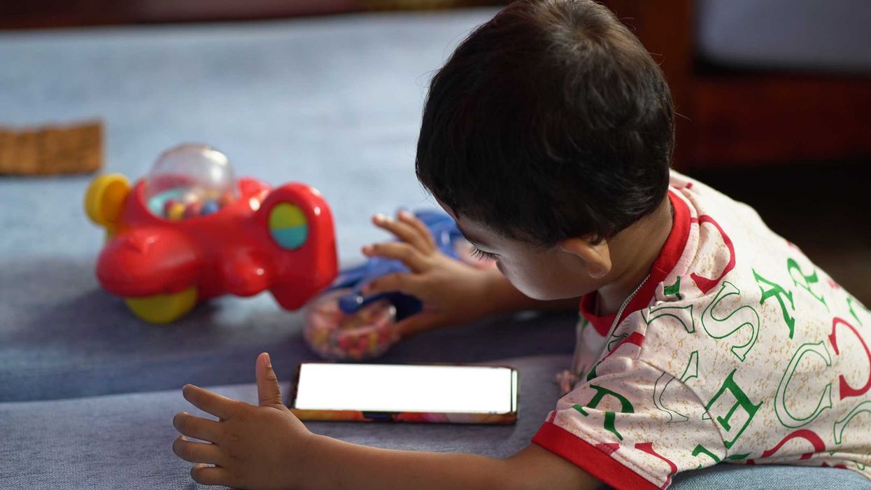 A child looking at a smartphone.