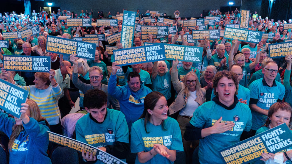A crowd of teals at a rally last month