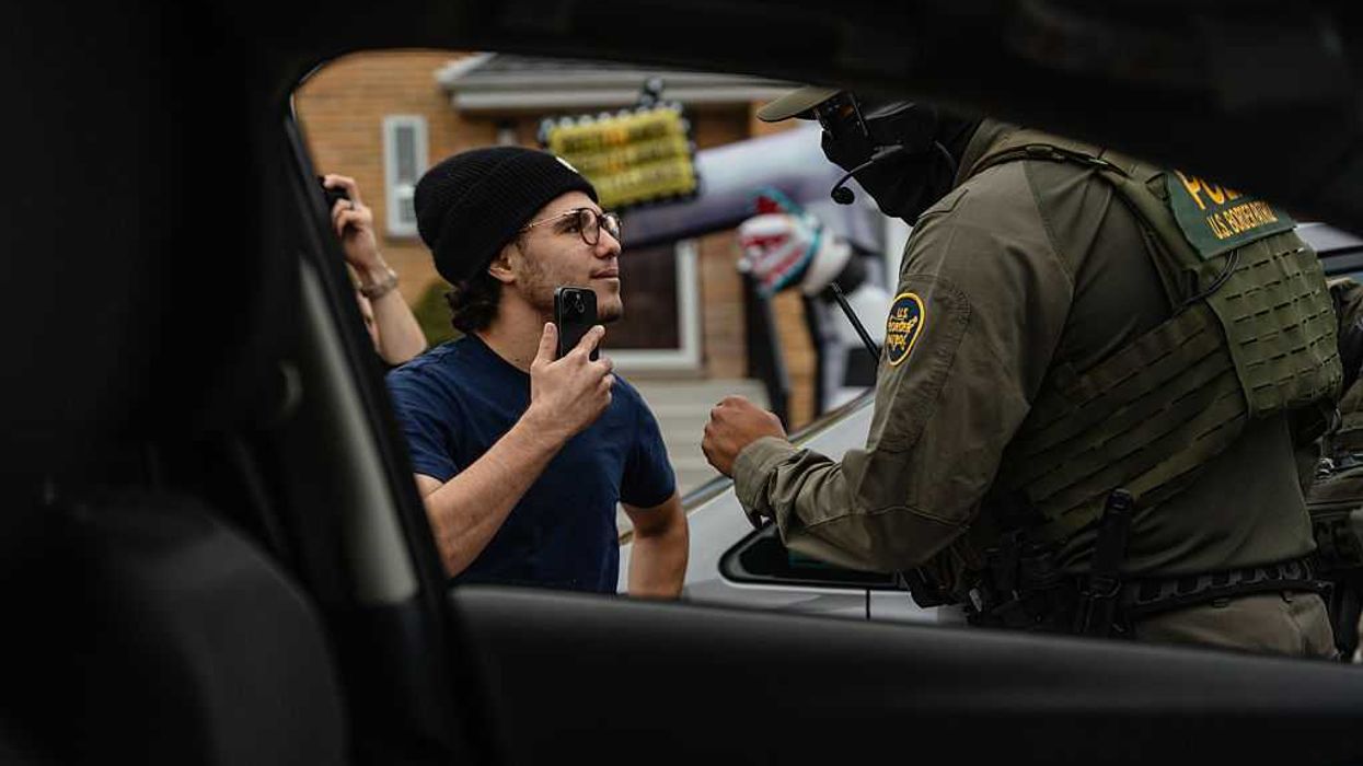 A federal agent and a young man having a confrontation.