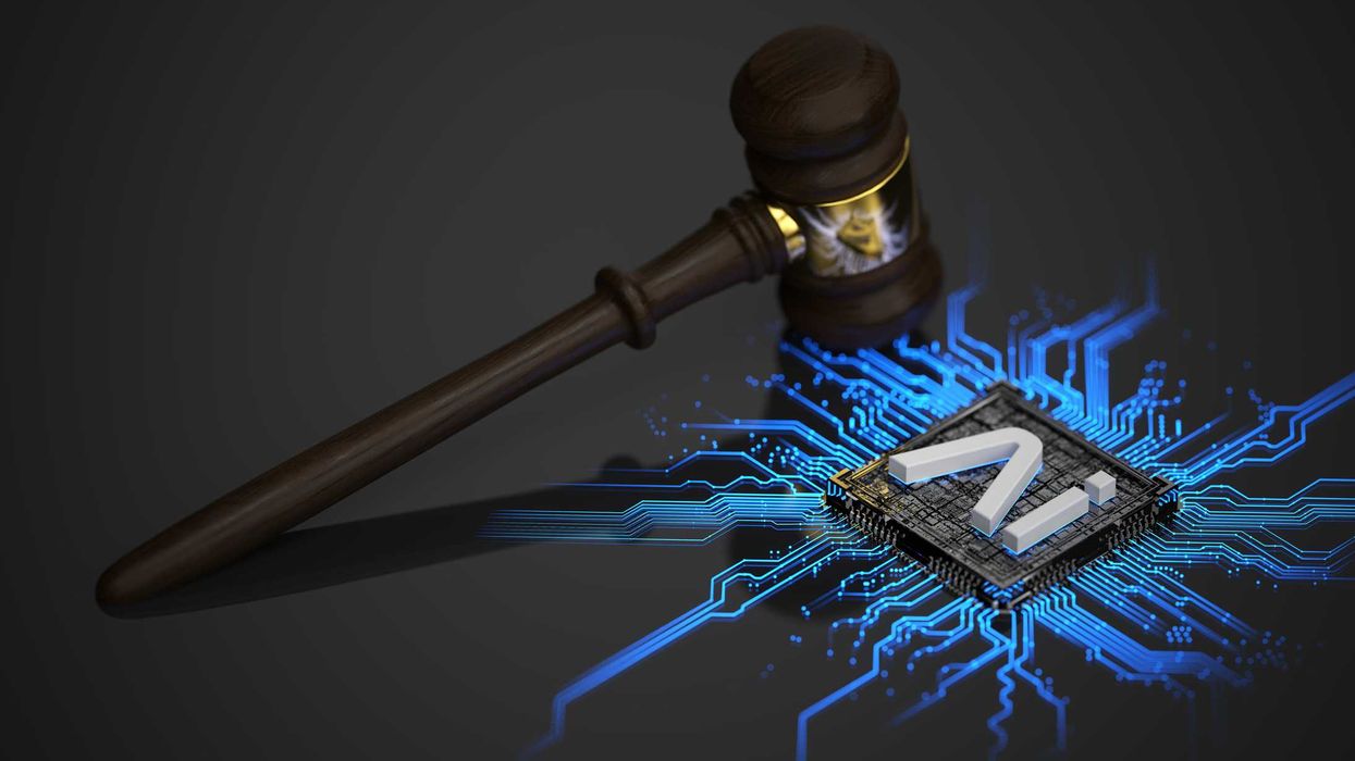 A gavel next to a computer chip with the words "AI" on it.