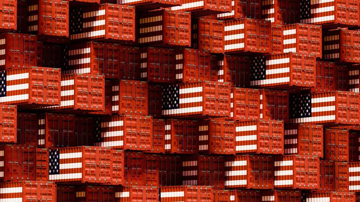 a grid wall of shipping containers in USA flag colors