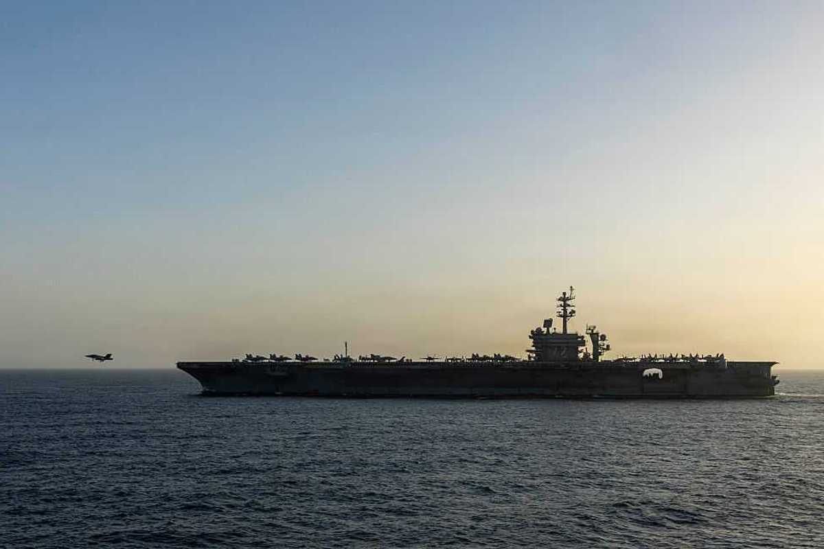 A military ship out in the sea.