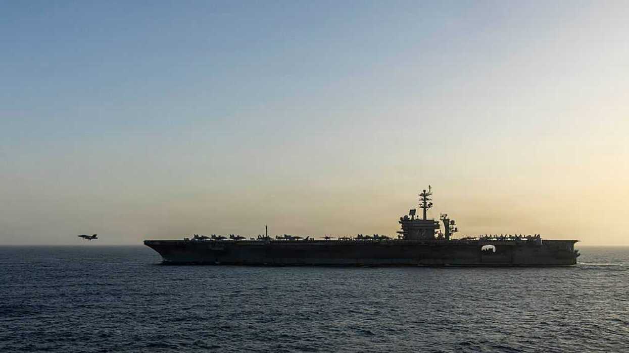 A military ship out in the sea.