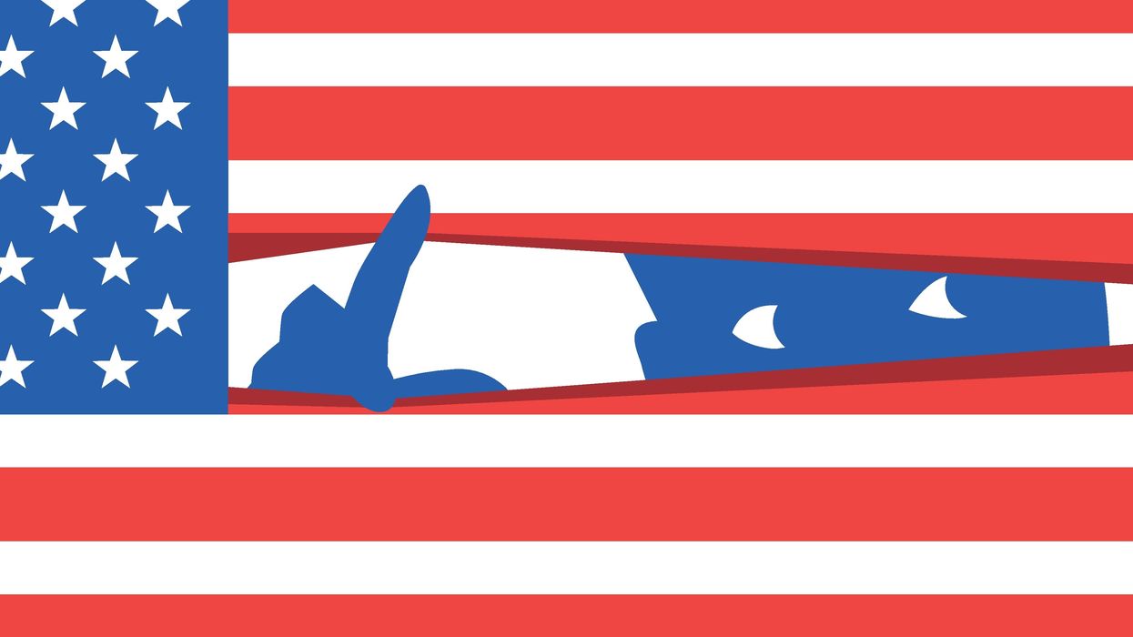 A person feelign anxiety, peering through an American flag