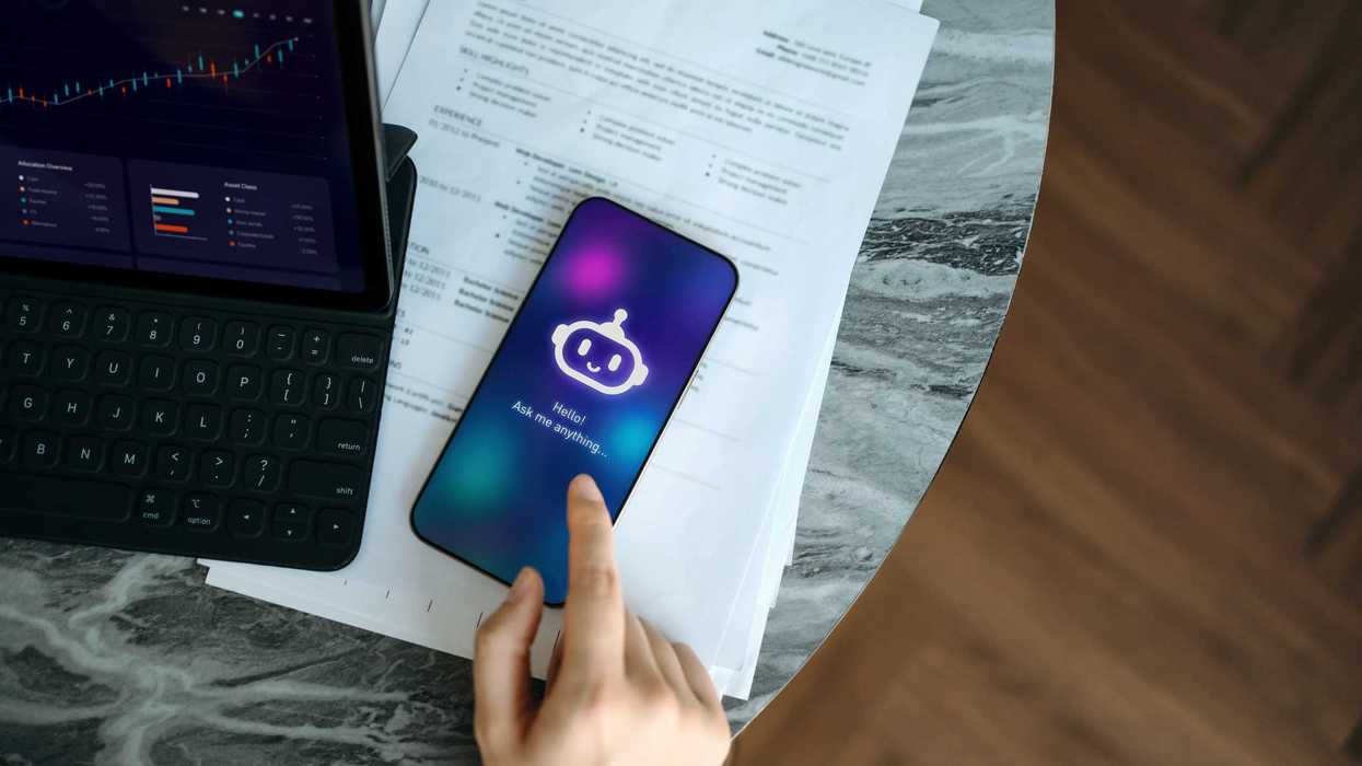 A person on their phone, using a type of artificial intelligence.