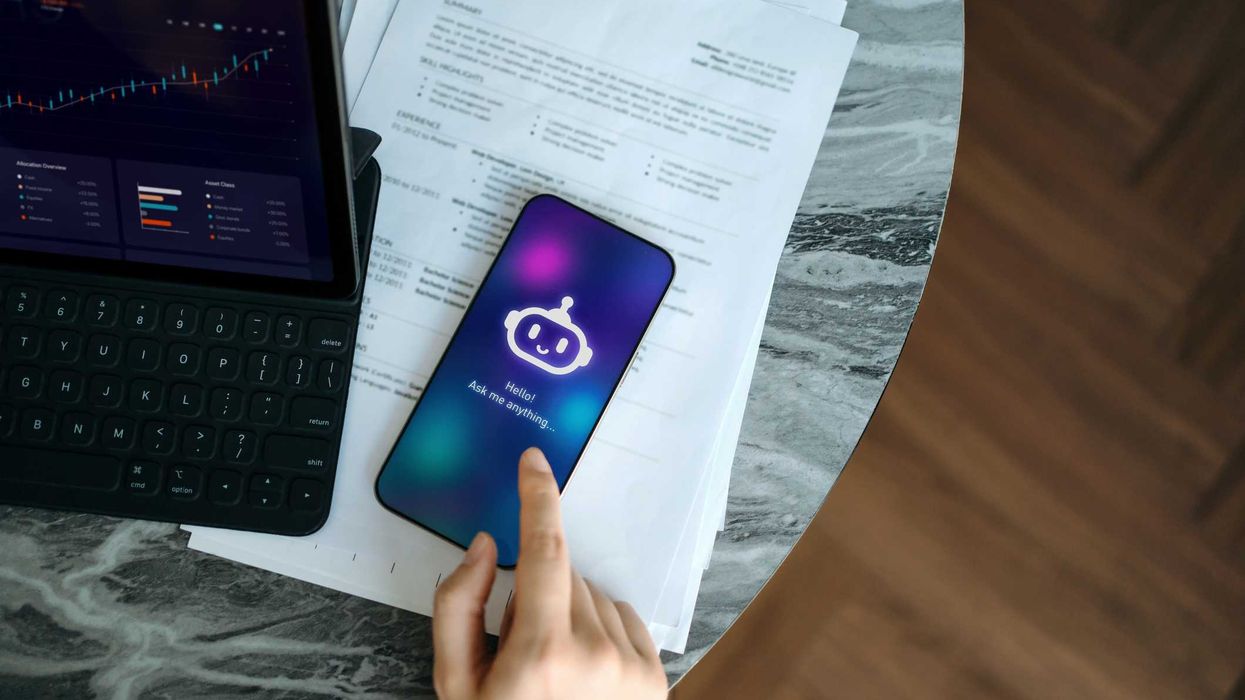A person on their phone, using a type of artificial intelligence.