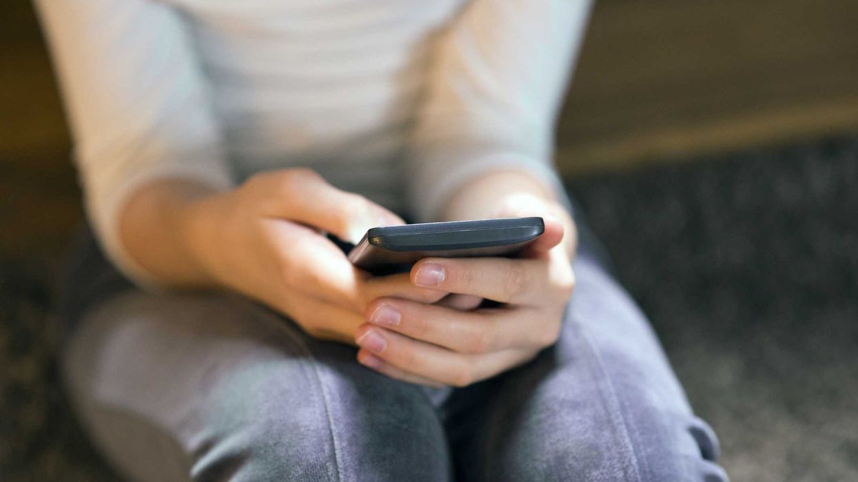 A person on using a smartphone.