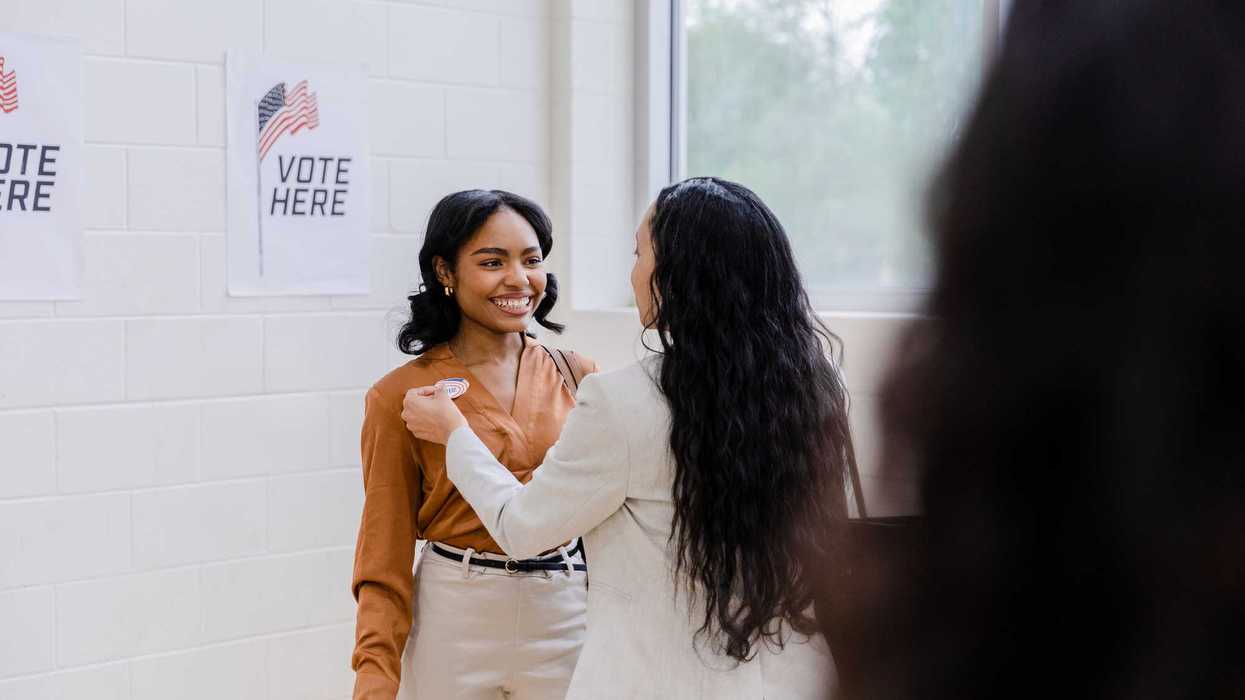 A person receiving a "I voted" sticker