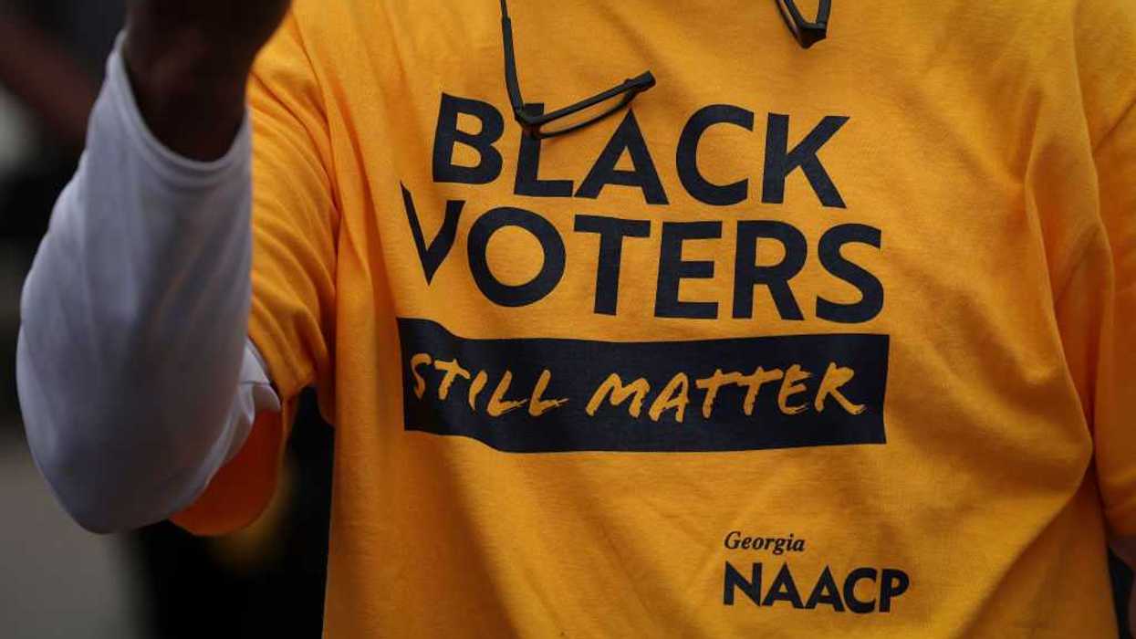 A person wearing a t-shirt that says, "Black Voters Still Matter."