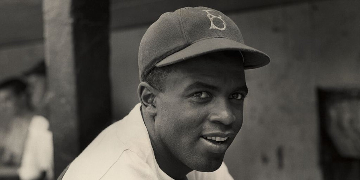 A photo of legendary baseball player Jackie Robinson in a Brooklyn Dodgers cap.
