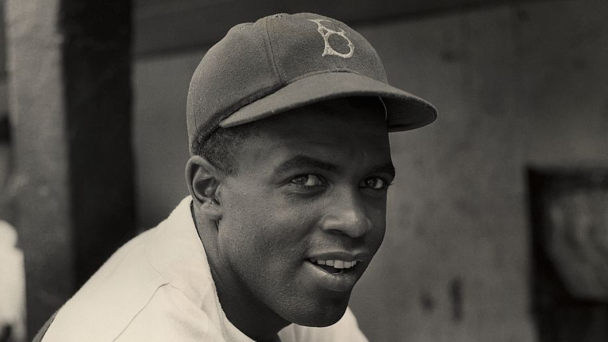 A photo of legendary baseball player Jackie Robinson in a Brooklyn Dodgers cap.