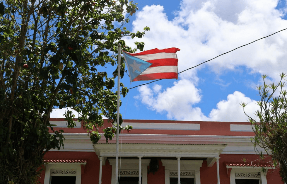 A Puerto Rican flag flies in the wind outside Casa Pueblo in Adjuntas