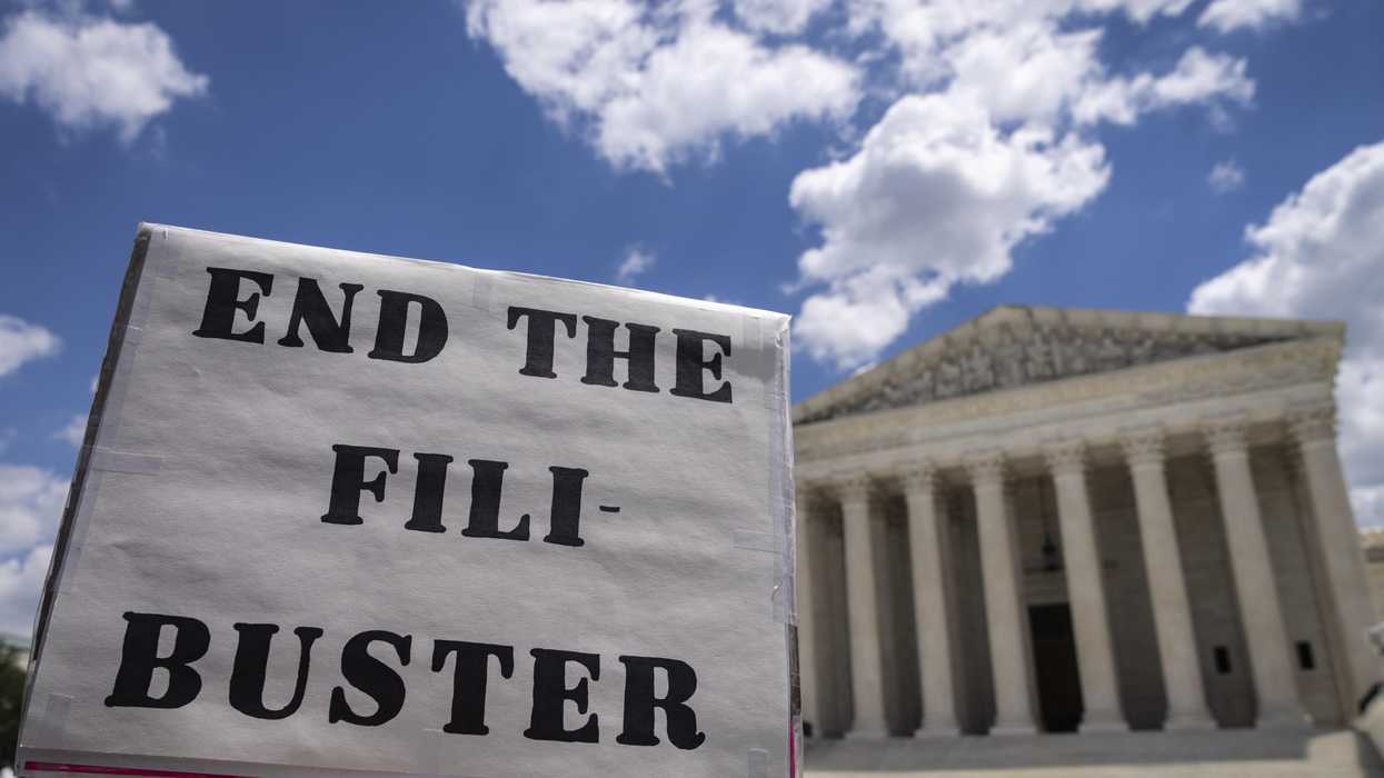 A sign that reads, "End the Filibuster"