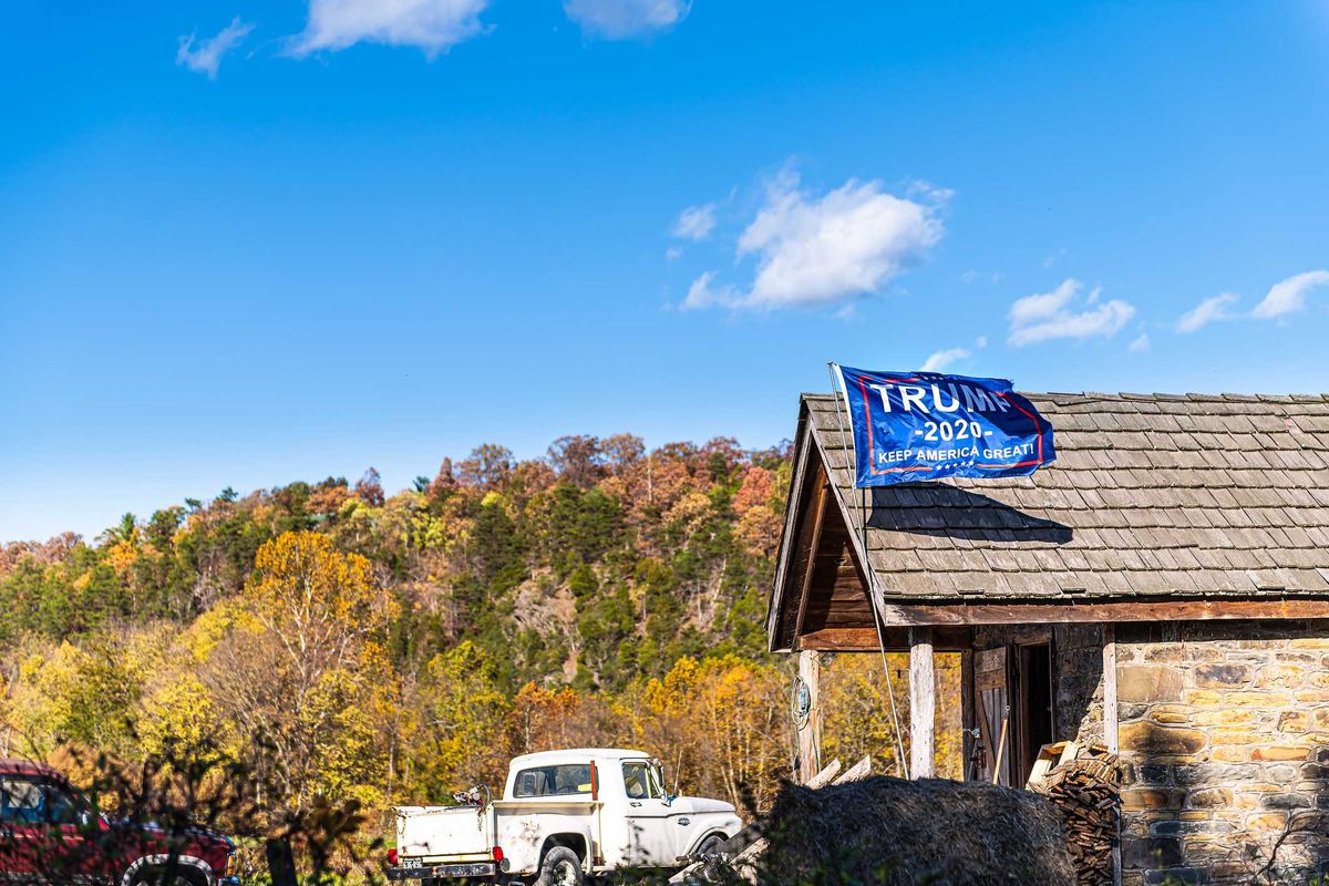 A Trump 2020 flag outside of a home.