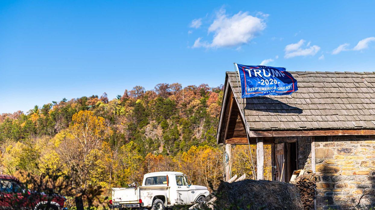 A Trump 2020 flag outside of a home.