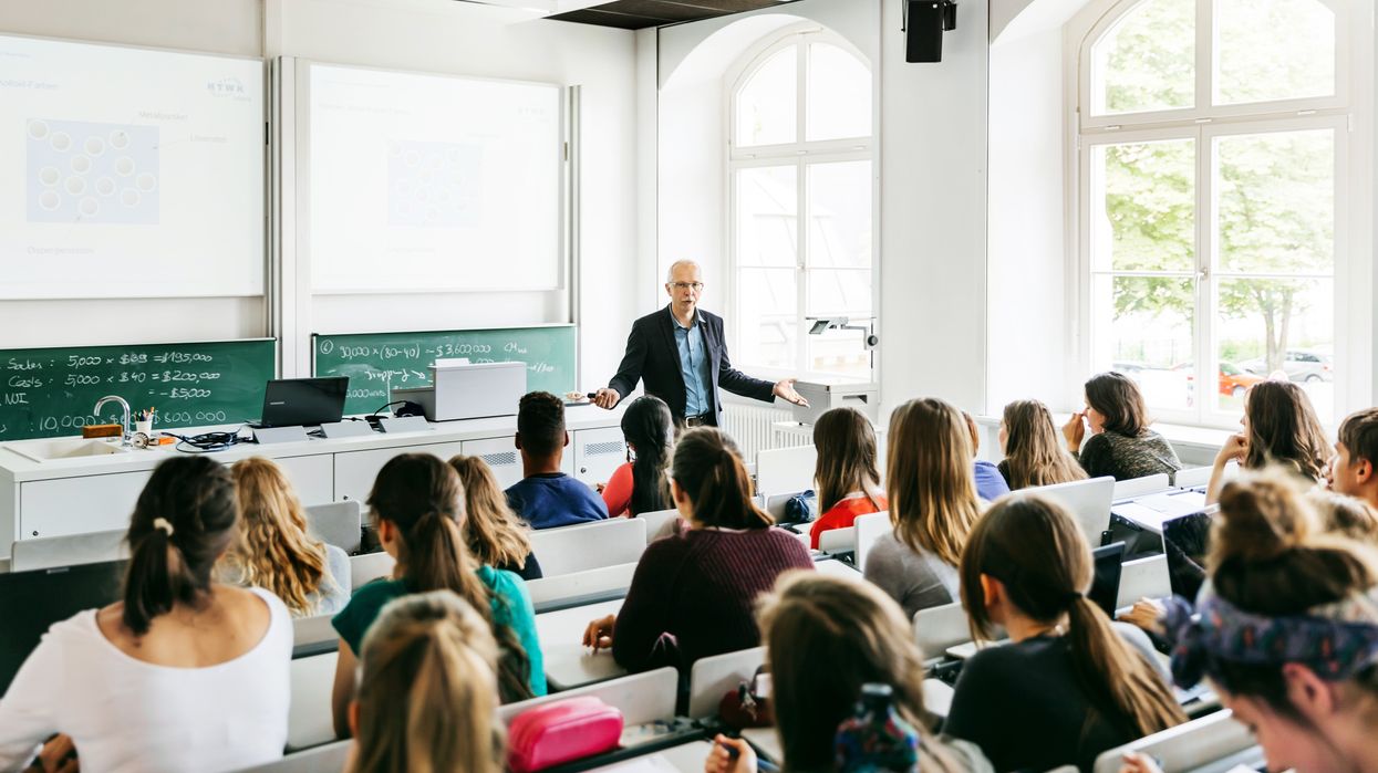 A university professor addressing his students