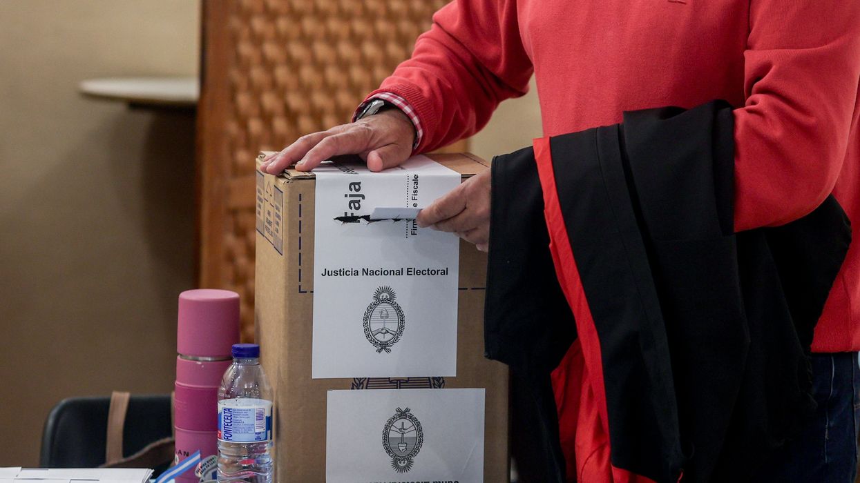 A voter submits a ballot in the Nov. 19, 2023, Argentinean election.