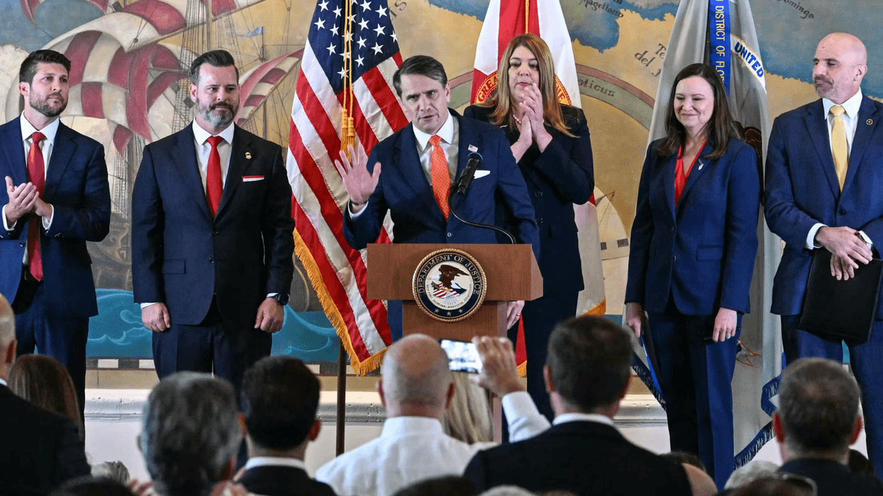 Acting U.S. Attorney General Todd Blanch standing in front of a crowd.