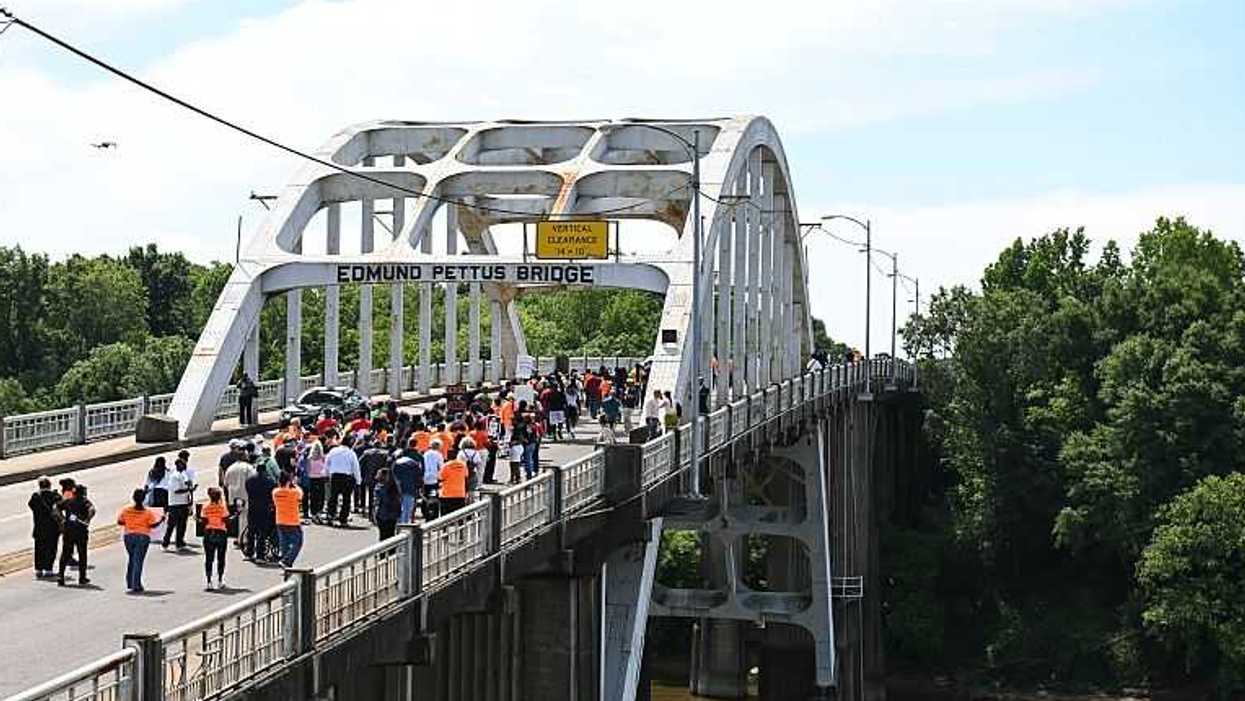Activists march across Edmund Pettus Bridge.
