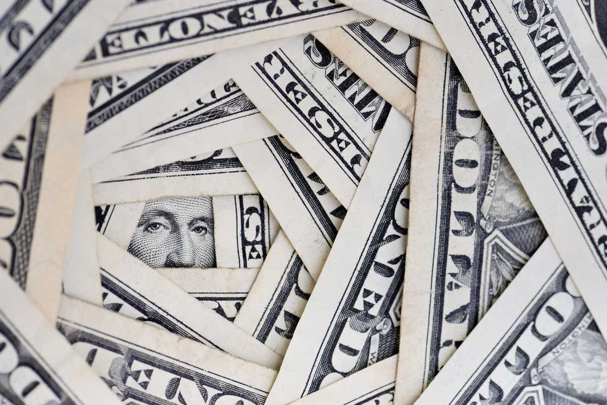 American dollars positioned around each other.