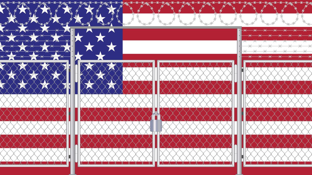 American flag behind a fence