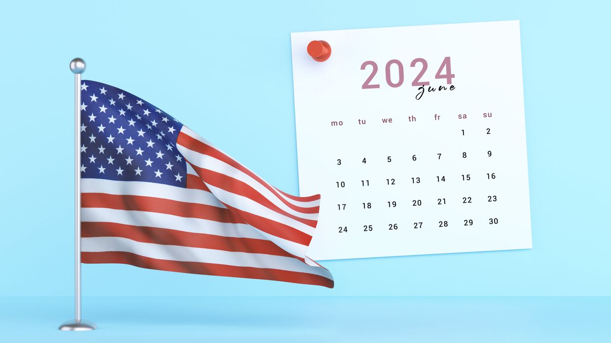 American flag next to calendar for June
