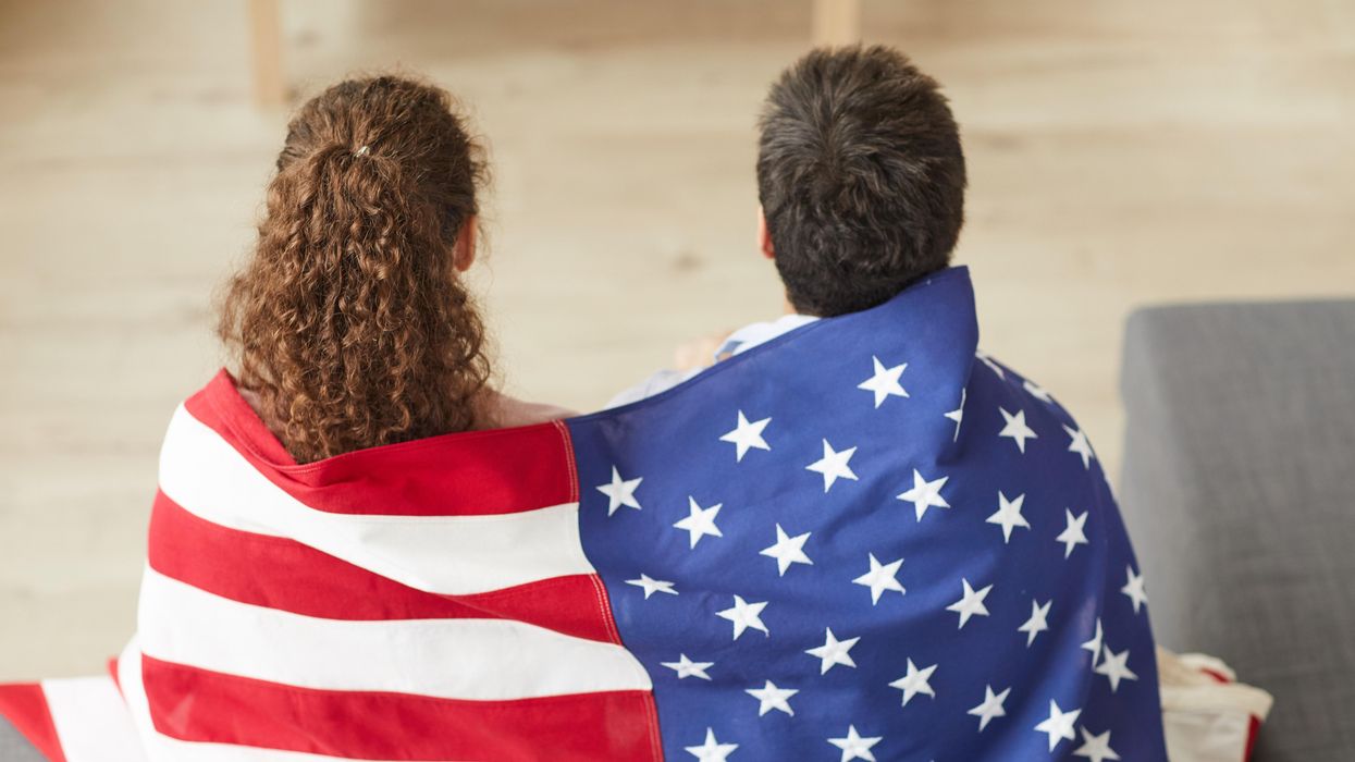 Americans wrapped in a flag