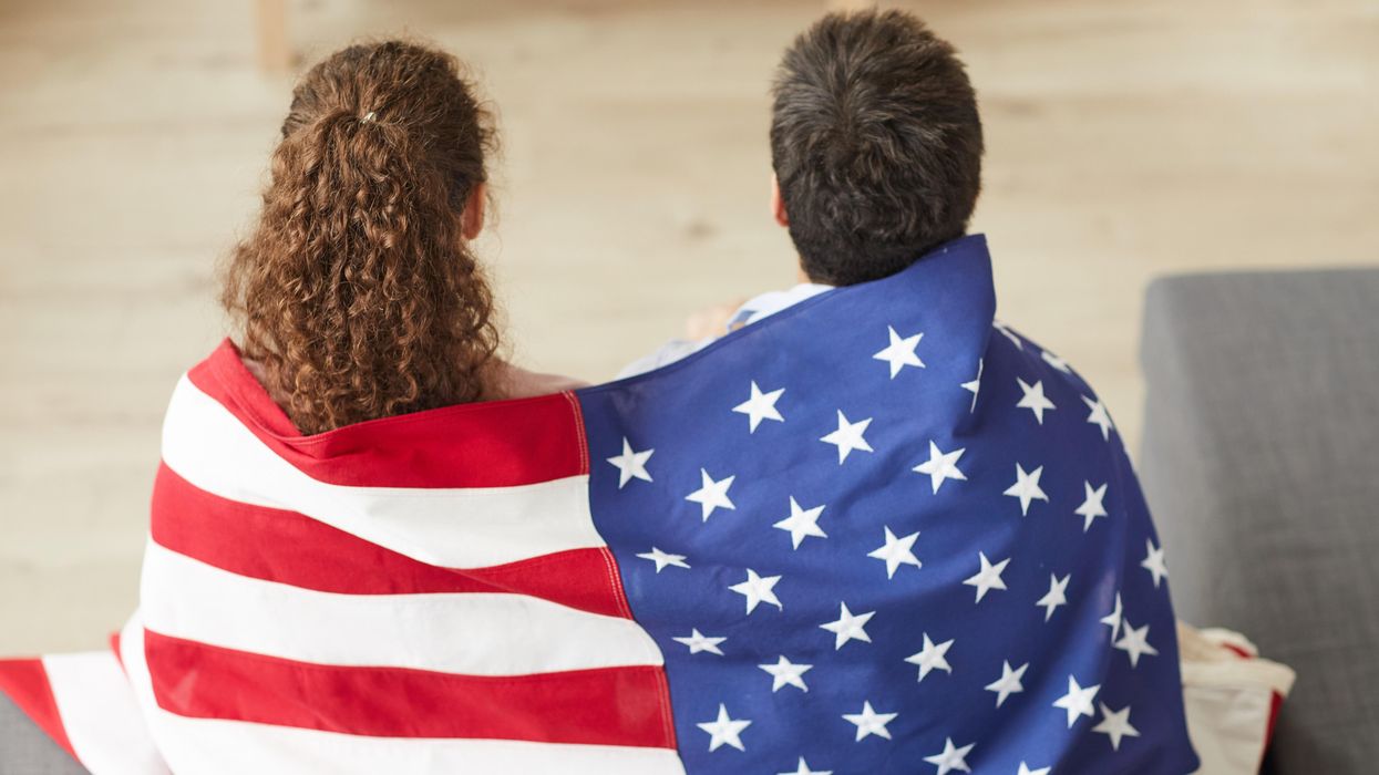 Americans wrapped in a flag