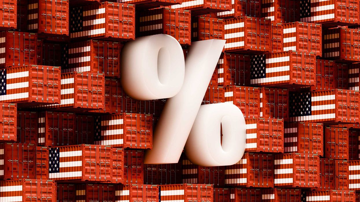 An abstract grid wall of shipping containers, unevenly arranged with some jutting out, all decorated in the colors and patterns of the USA flag. A prominent percentage sign overlays the grid.