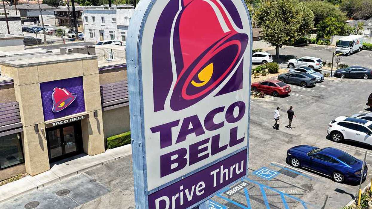 An aerial view of a taco bell and a taco bell sign.