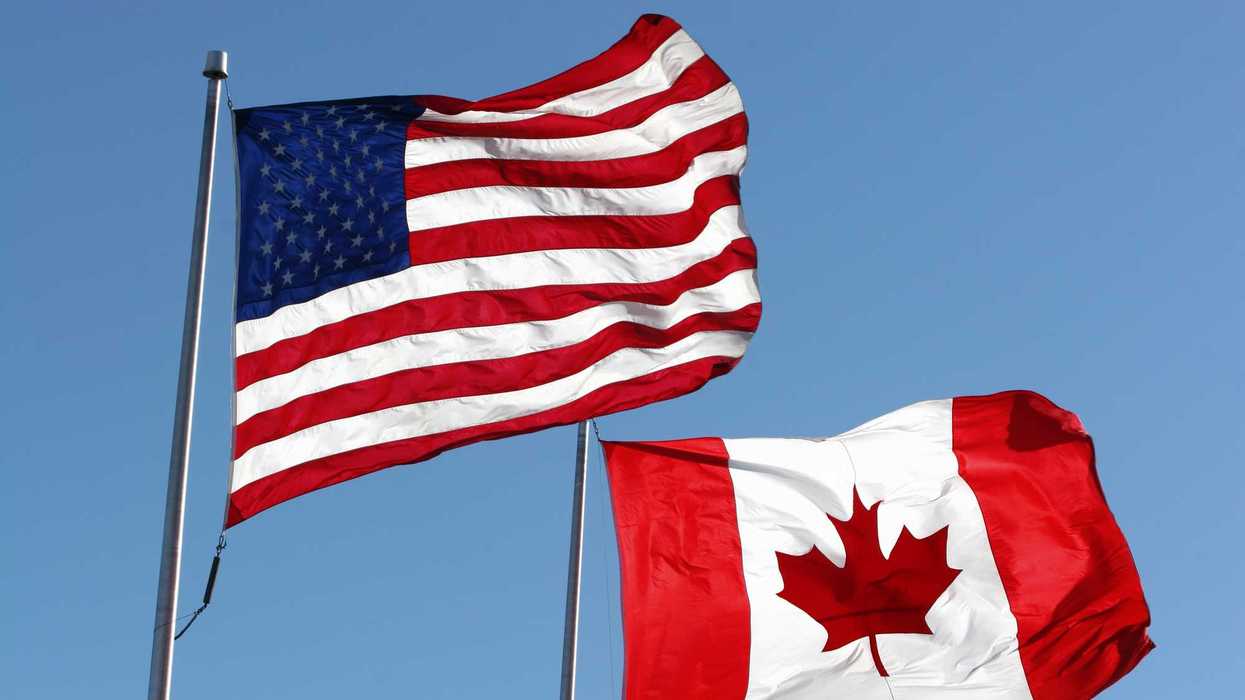 An American & Canadian flag waving in the wind