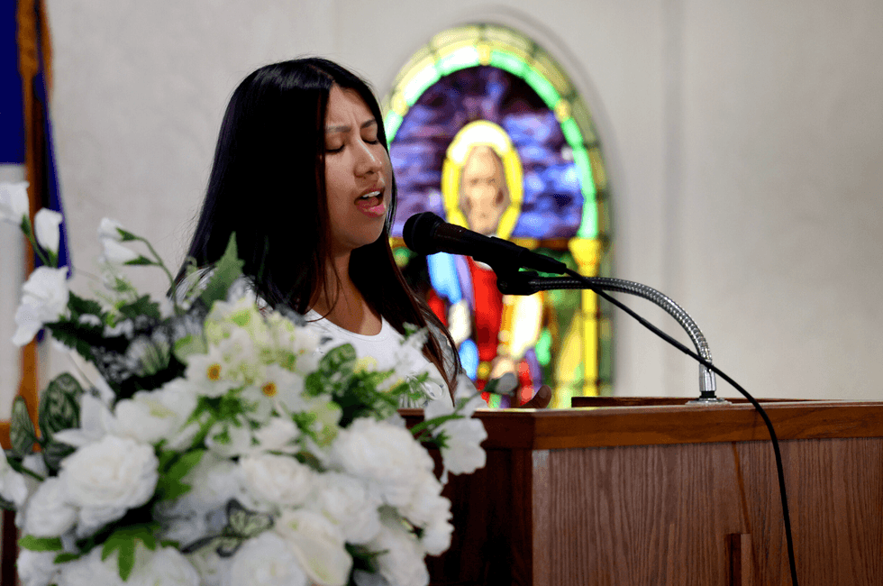 Ashley Ambrocio sings to the congregation at Iglesia de Santidad Vida Nueva on Sunday, June 29, in Wimauma, Florida.