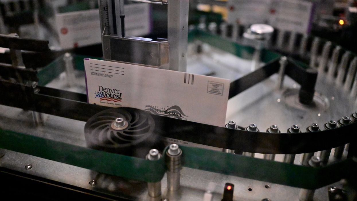 Ballot envelopes moving through a sorting machine
