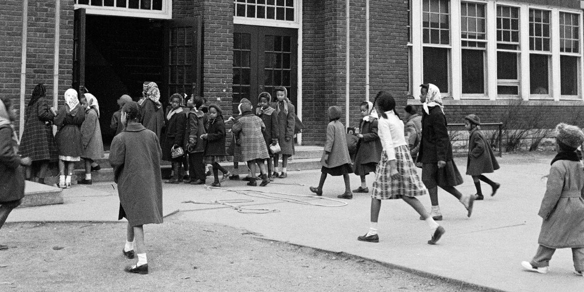Black children entering a school