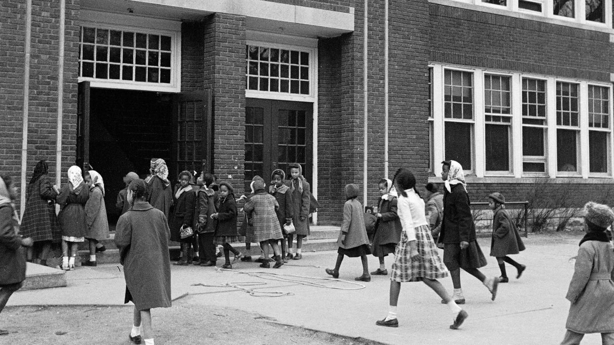 Black children entering a school