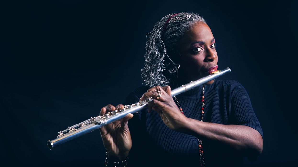 Black woman playing the flute