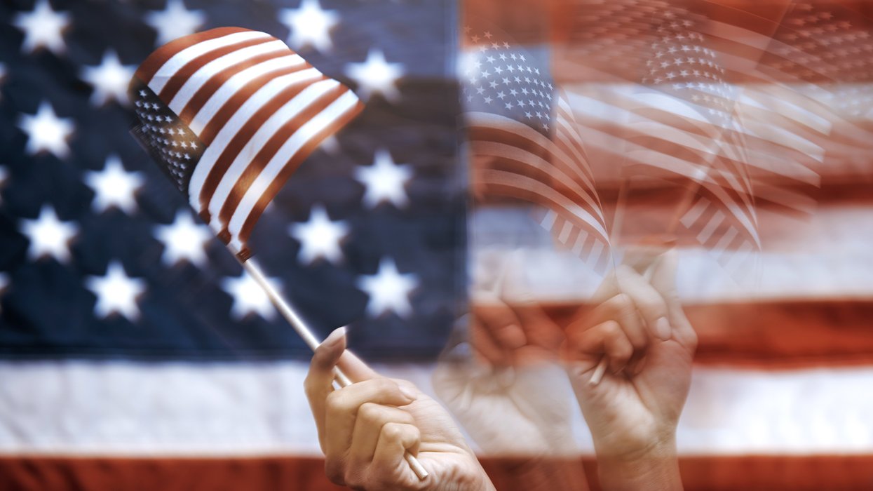 Blurred images of a hand waving an American flag