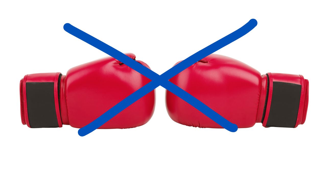 Boxing gloves covered by an "X"