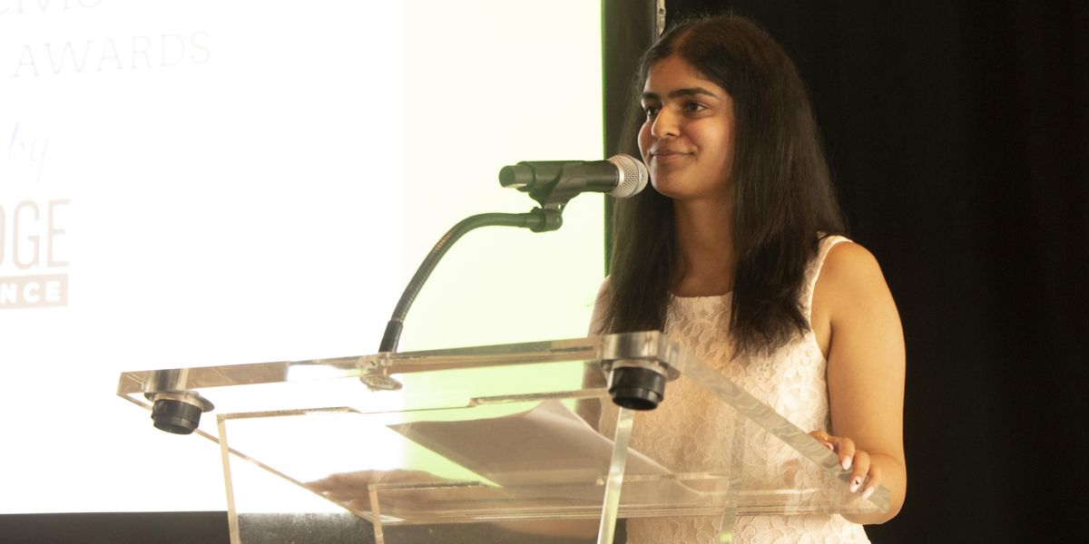 Bridge Alliance intern Sachi Bajaj speaks at the June 12 Civvy Awards.