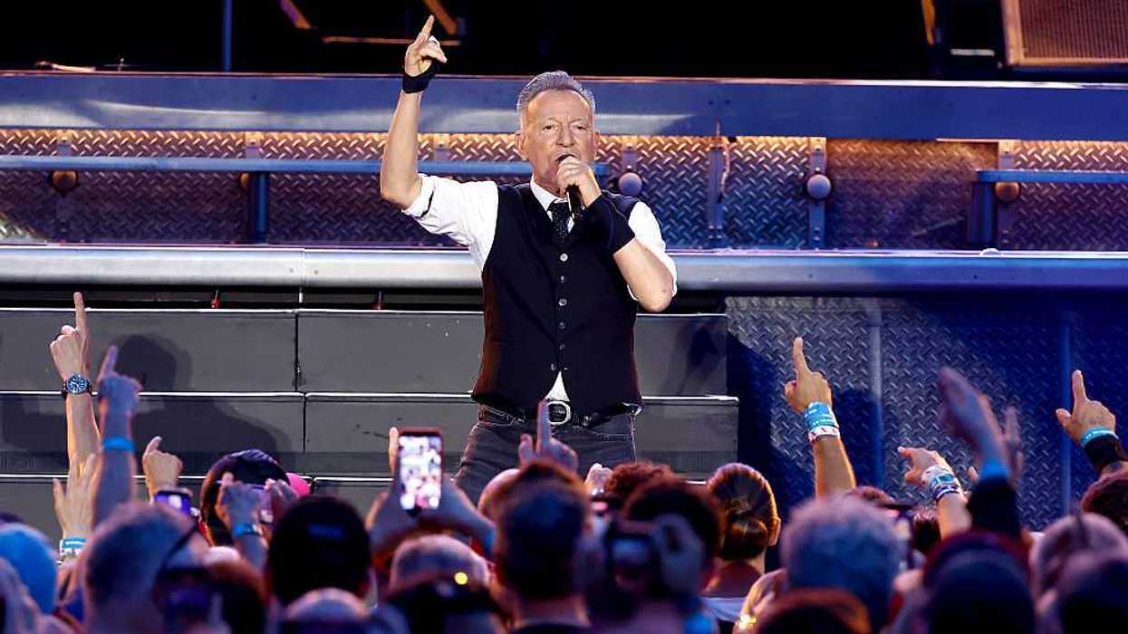 Bruce Springsteen In Concert, facing his audience.