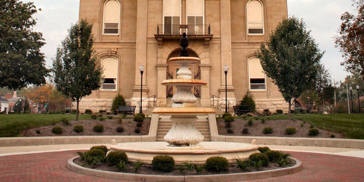 Building with a fountain in front
