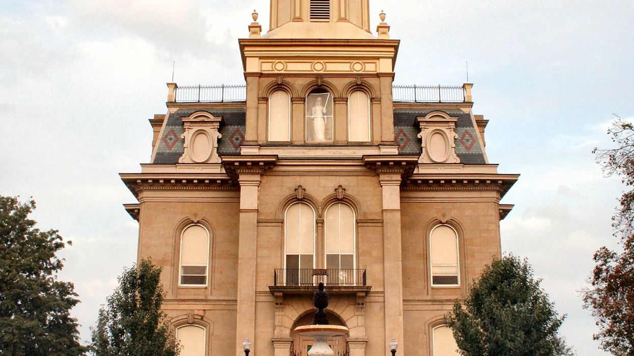 Building with a fountain in front