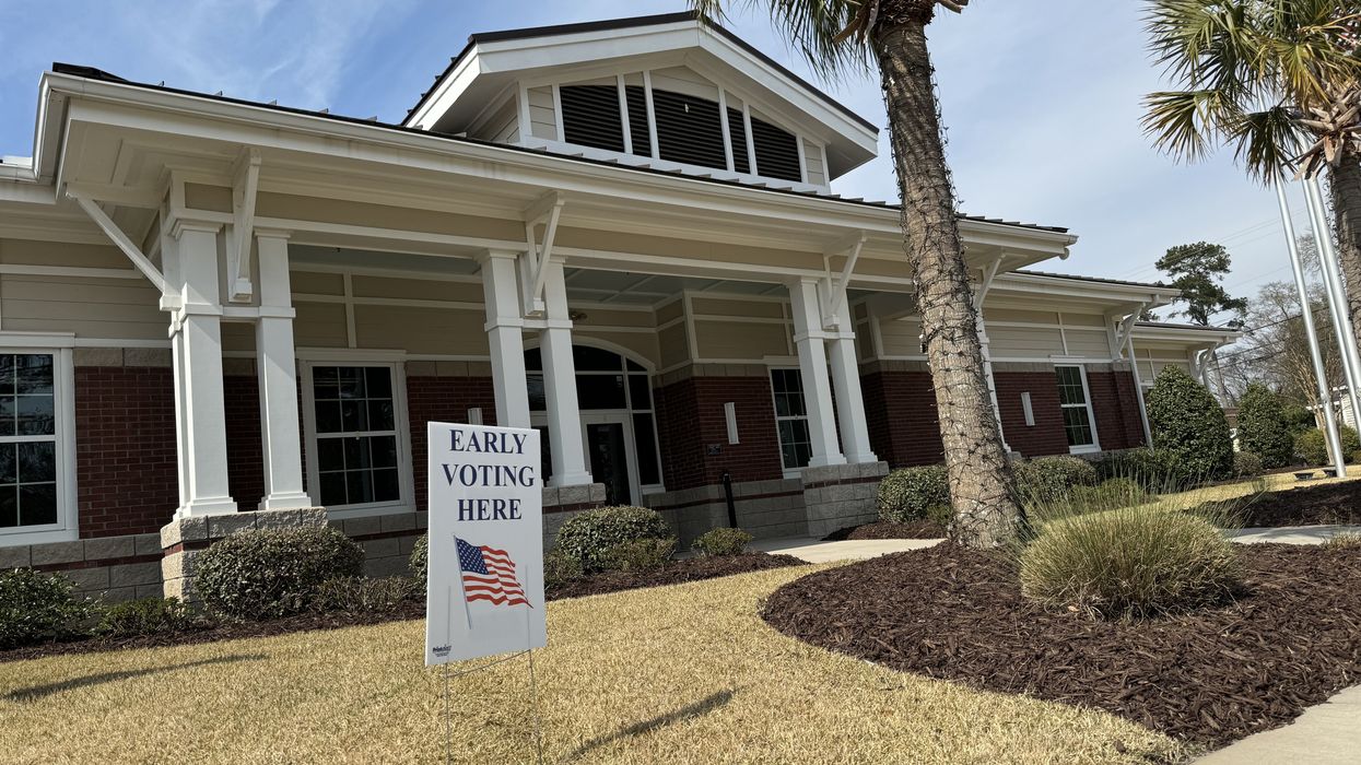 Building with "Early Voting Here" sign