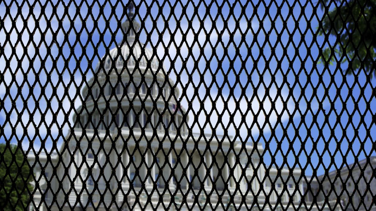 Capitol behind a fence