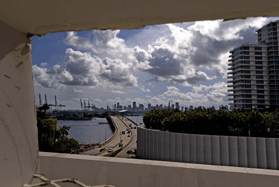 Cars drive on the MacArthur Causeway toward downtown Miami