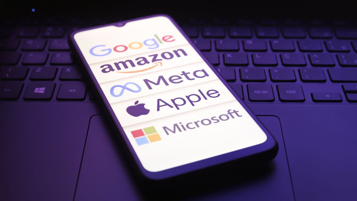 Cell phone showing logos of Google, Amazon, Meta, Apple and Microsfot