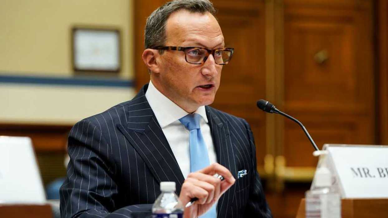 Center for Election Innovation and Research Executive Director and Founder David Becker speaking into a microphone, while sitting down.
