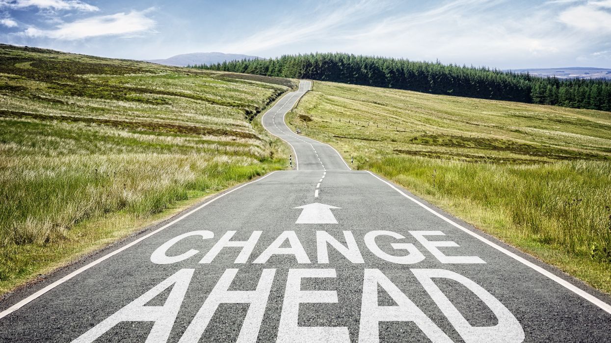 "Change Ahead" painted on a rural road