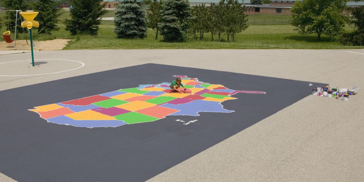 Child coloring a map of the United States