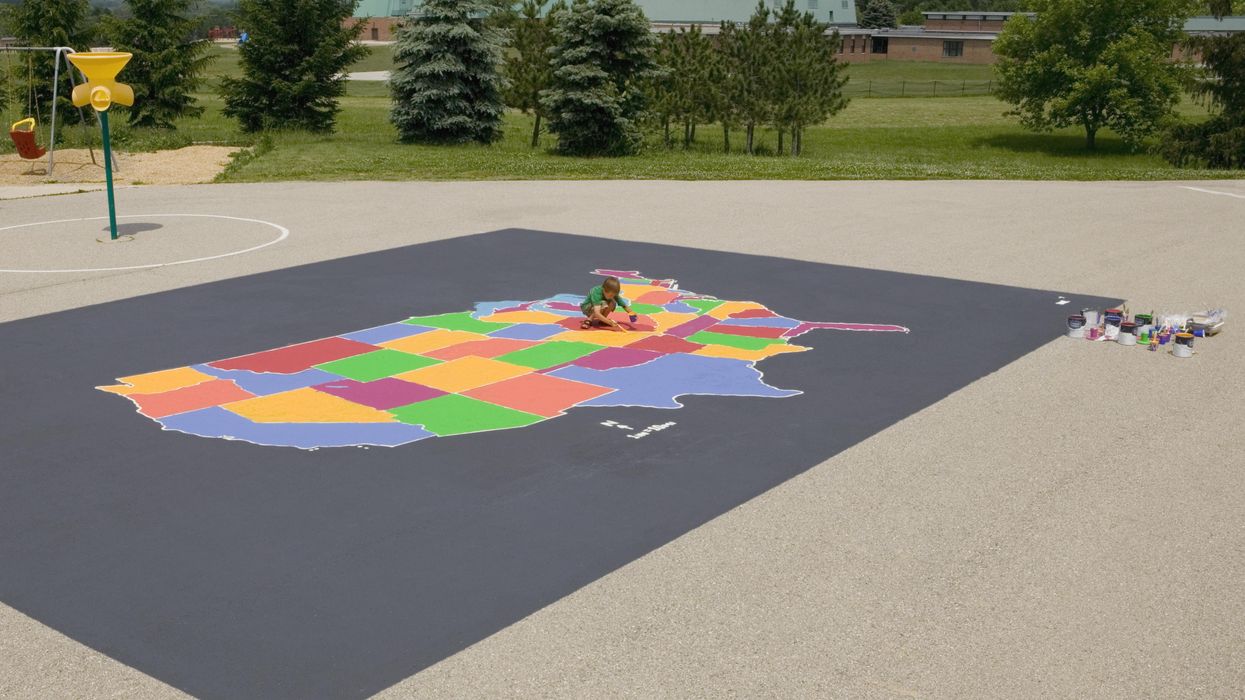 Child coloring a map of the United States